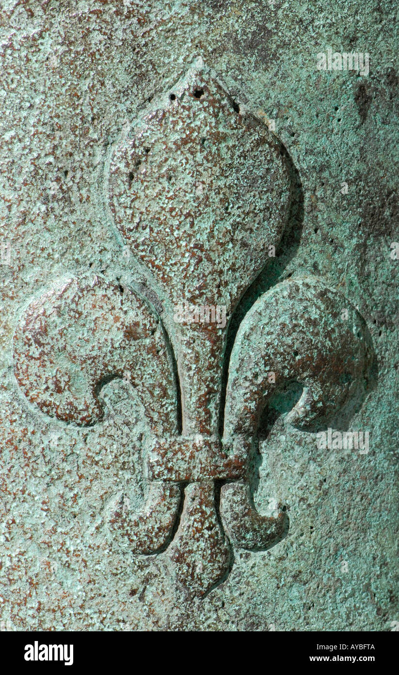 Fleur de lis or fleur de lys cast in bronze on a French canon as a symbol of the French monarchy Stock Photo