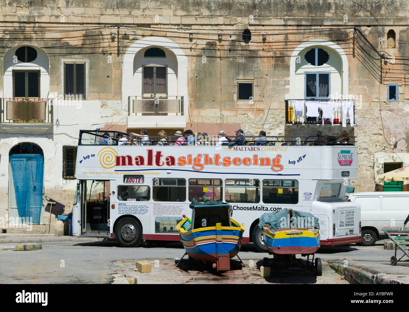 Sightseeing tour bus in Marsaxlokk, Malta Stock Photo