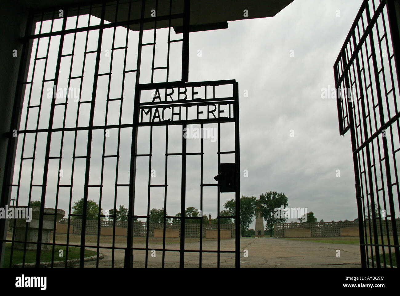 The 'Arbeit Macht Frei'  ('work brings freedom') in the entrance gate to the former Nazi concentration camp at Sachsenhausen. Stock Photo