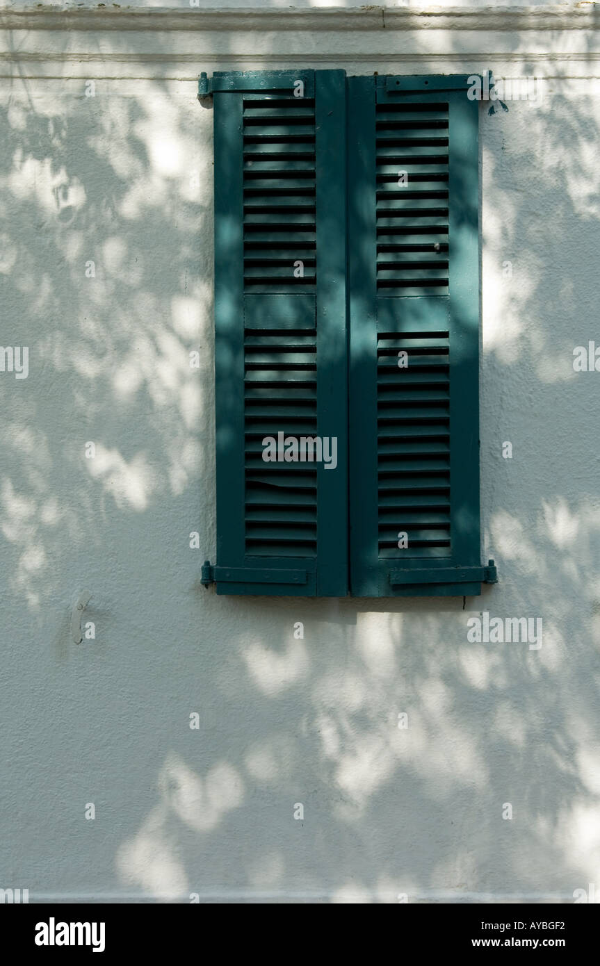 Green wooden shutters at Birla House, Mahatma Ghandi's final home and the location of his assassination. New Delhi, India. Stock Photo