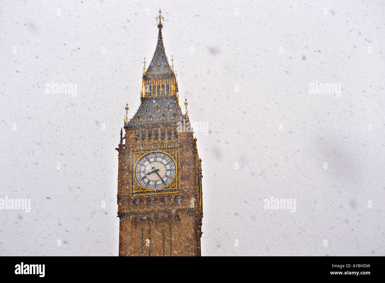 Big Ben clock, The Houses Of Parliment, Westminster London in the snow with large snow flakes falling Stock Photo