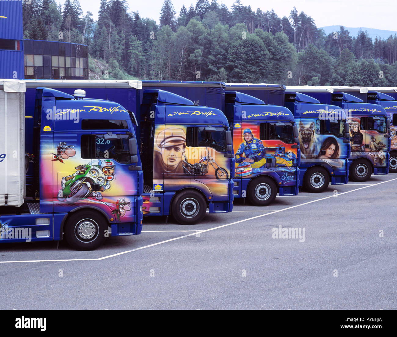 TRANSPORT DECORATED TRUCKS TLINE OF 5 PARKED JEAN ROUILLON TRANSPORT Stock Photo
