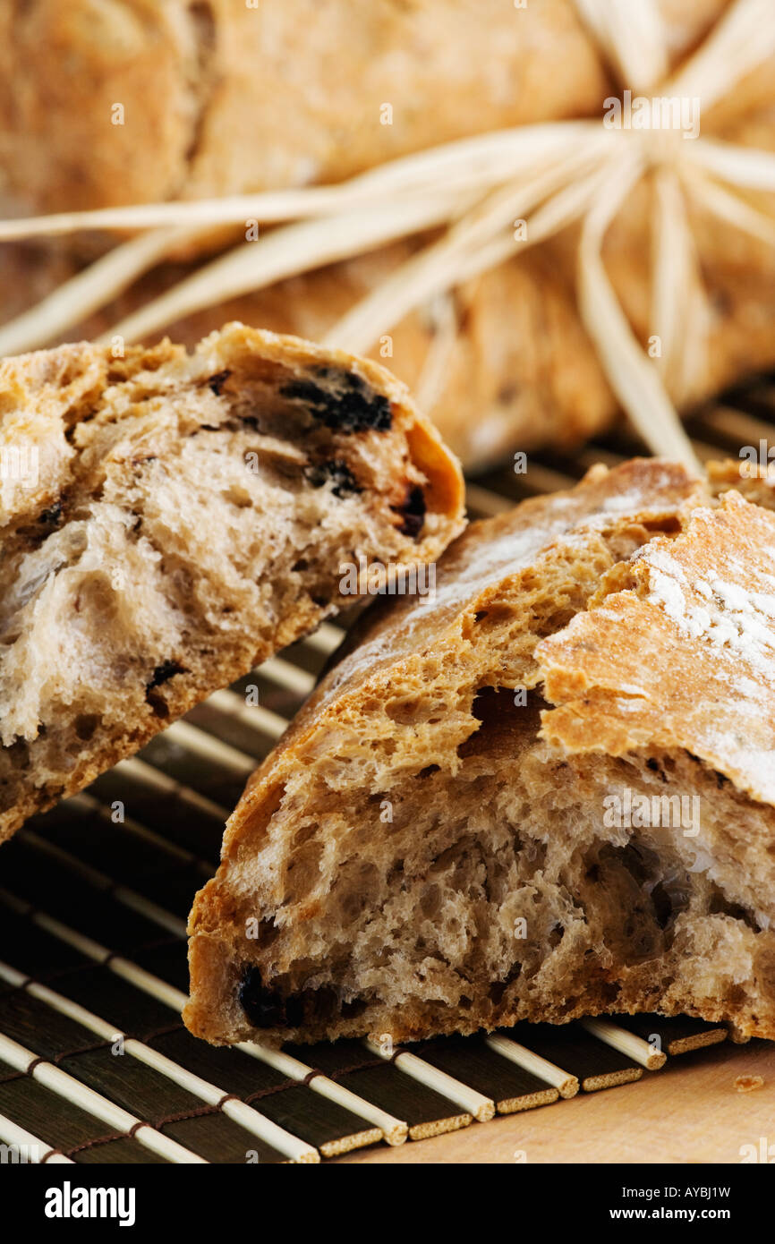 Crisp Italian olive bread on bamboo matt Stock Photo