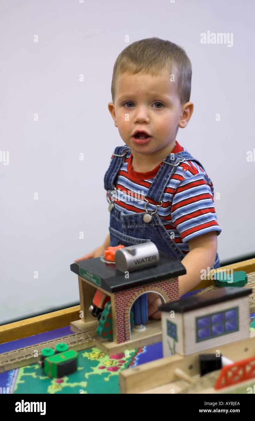 Toddler at train table 2 Stock Photo Alamy