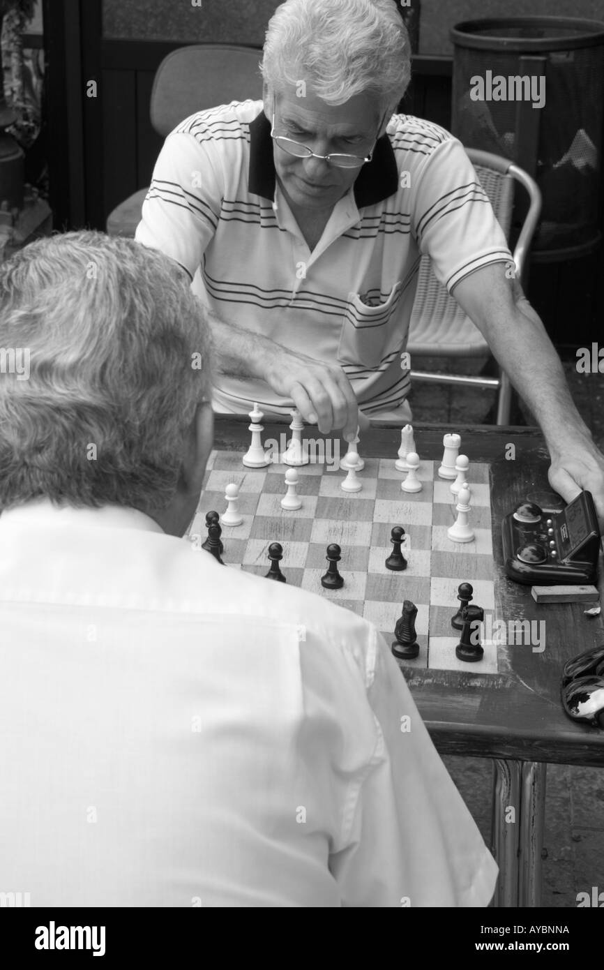 Two guys playing chess Stock Photo by ©MichalLudwiczak 74522861