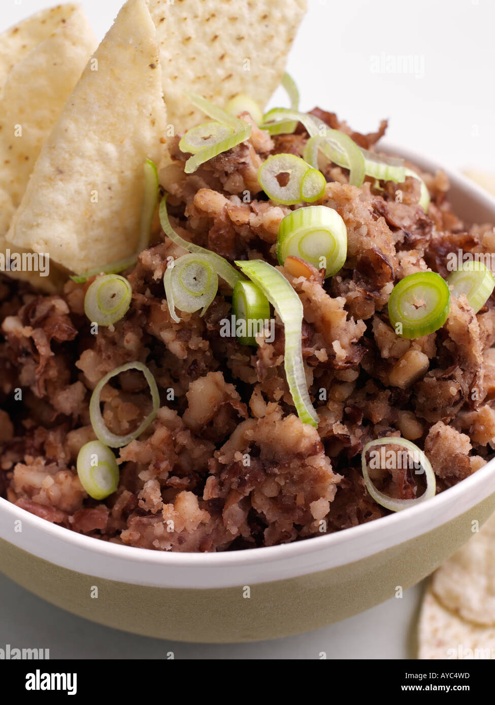 Bowl of refried beans and tacos Stock Photo Alamy