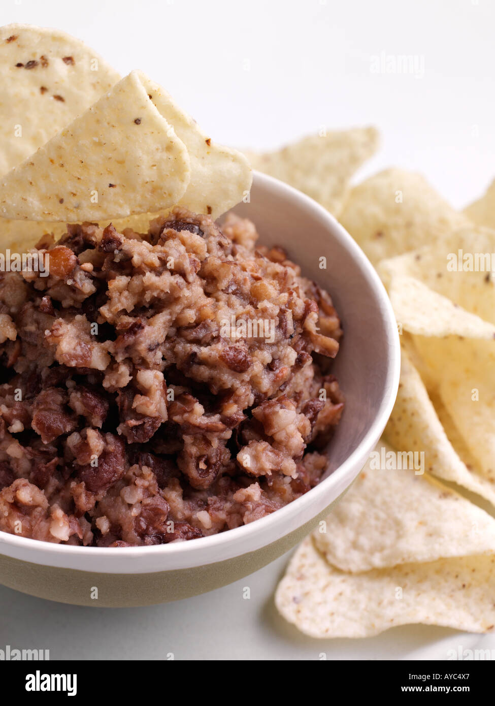 Bowl of refried beans and tacos Stock Photo Alamy