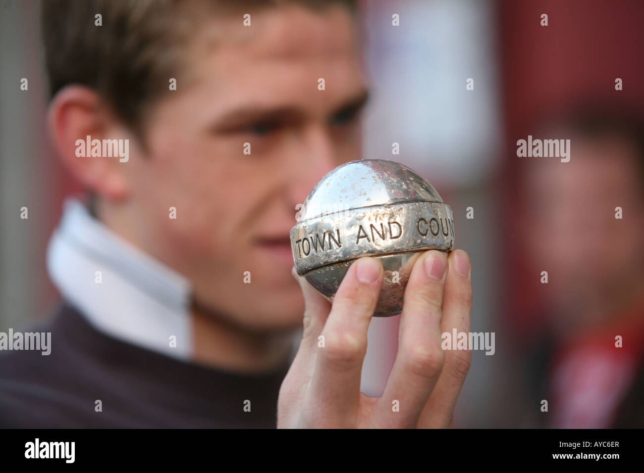 A player holds up the ball before the traditional Shrove Tuesday St Columb hurling match Stock Photo