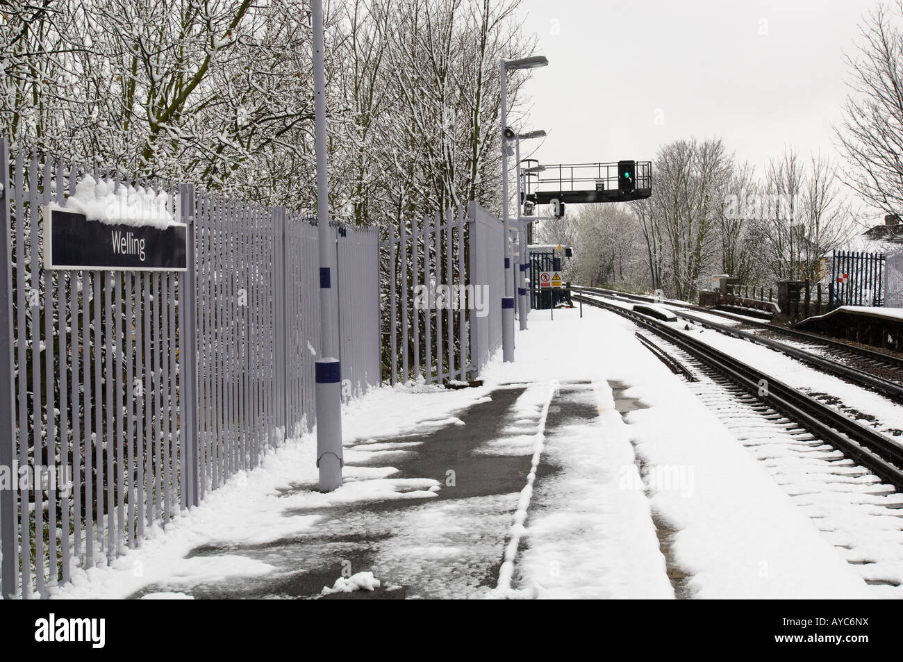Snow on a London railway platform and tracks. Stock Photo