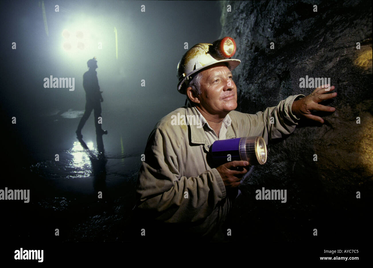 Geologist examines strata in an Australian mine Stock Photo