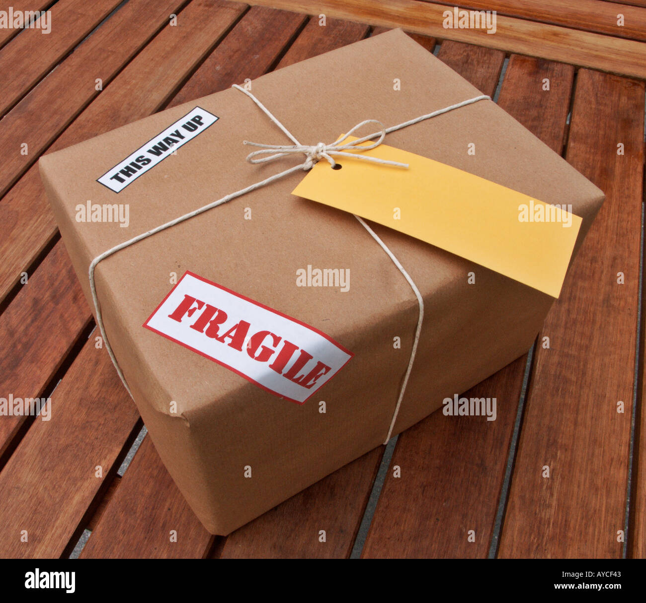 Parcel wrapped with brown packing paper Stock Photo by ©AndriiGorulko  9972809