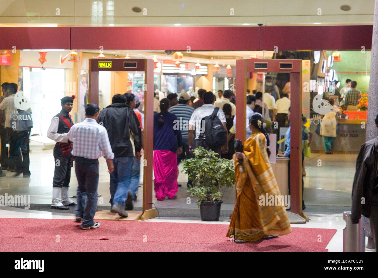 Security checks at entrance of a modern Indian shopping mall and