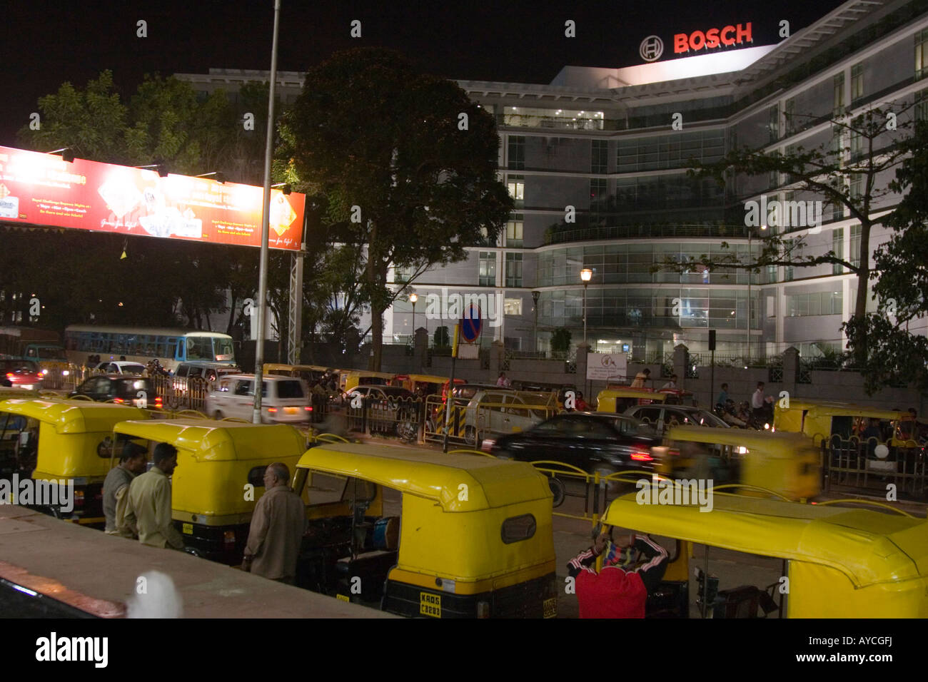 Queue of auto rickshaw taxis and drivers outside a shopping mall in Bangalore India Stock Photo