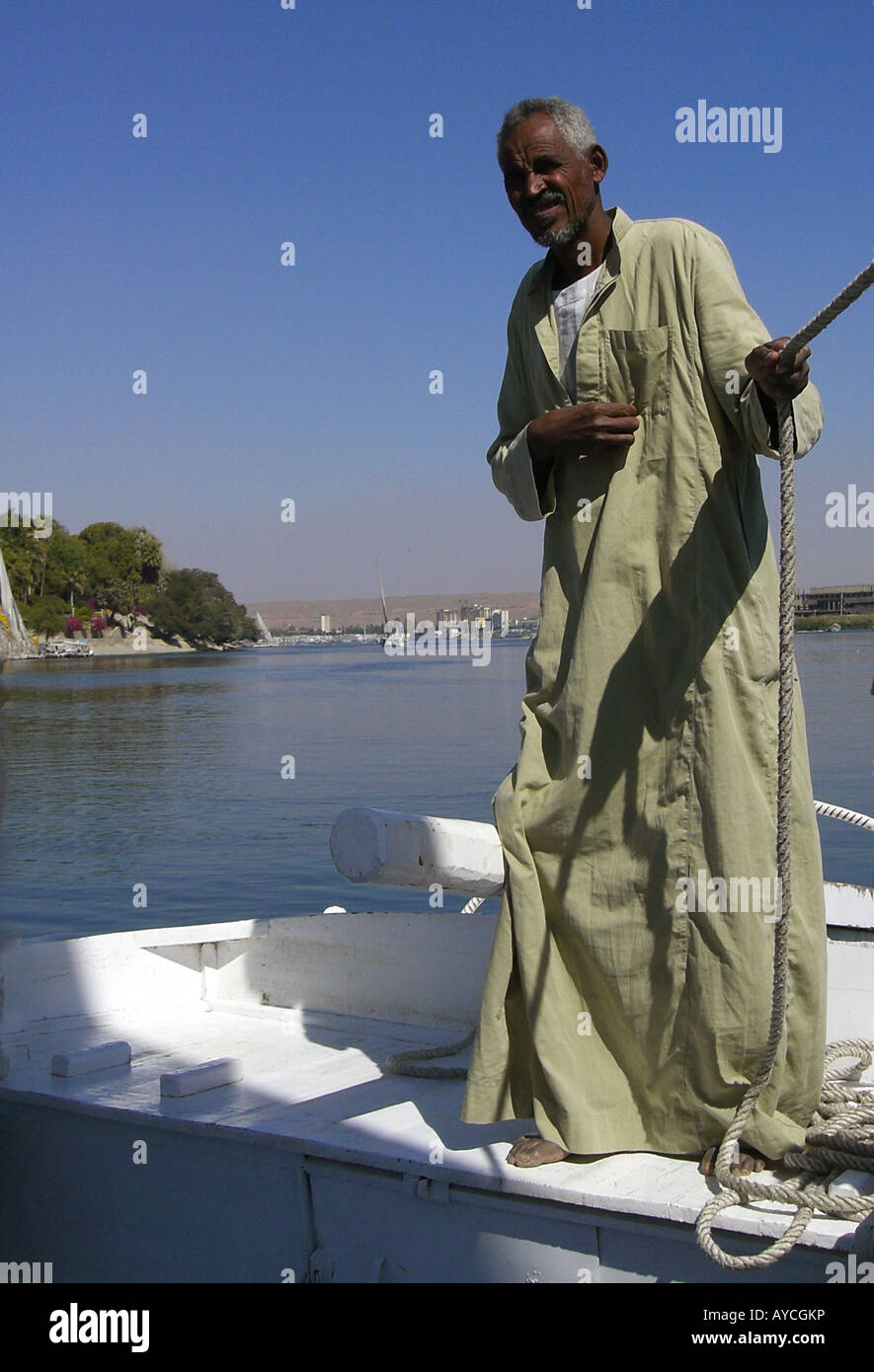 Man sailing felucca Aswan Egypt River Nile Stock Photo