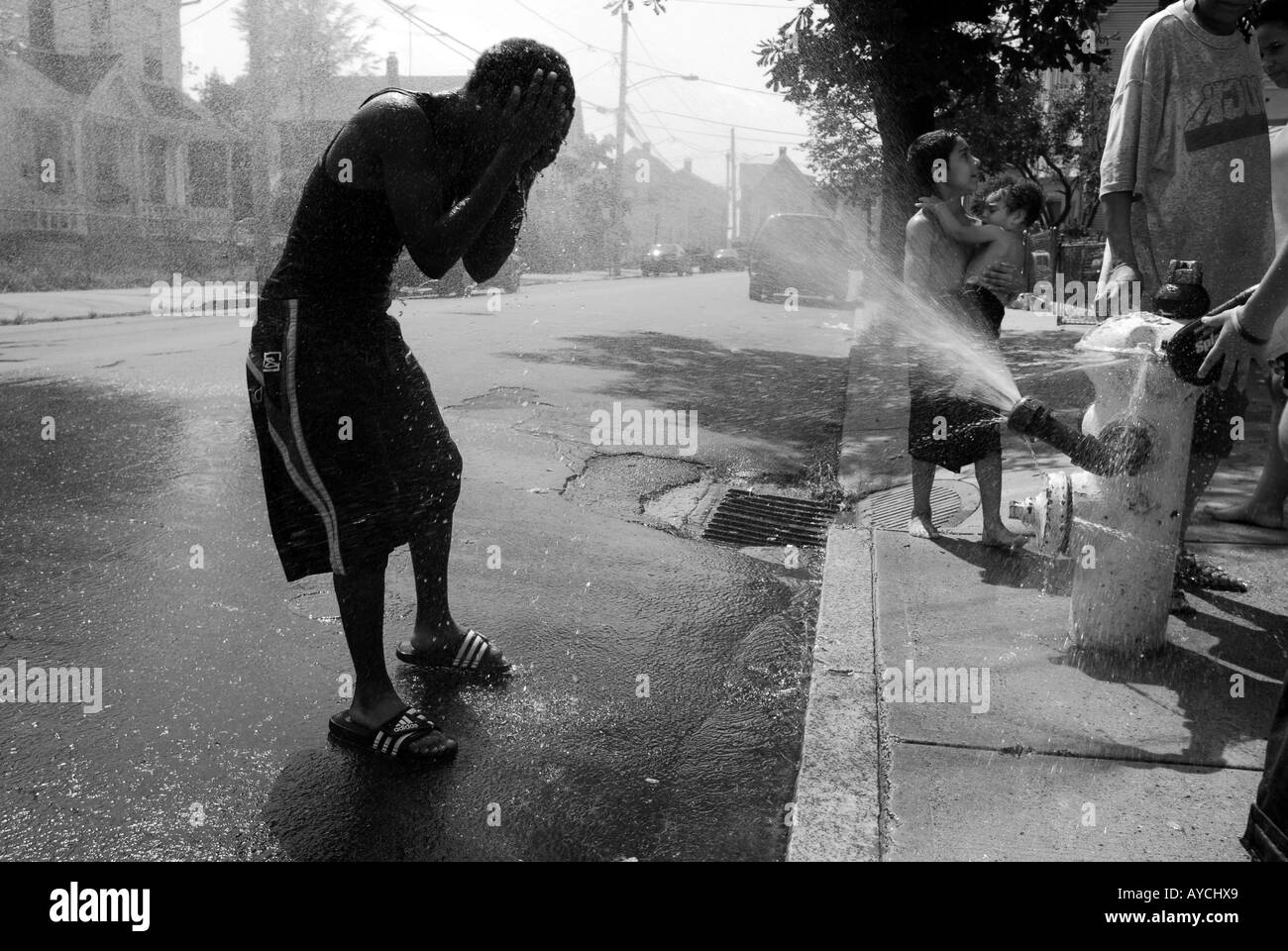Child cooling off during summer heat wave in New Haven, CT USA 2007