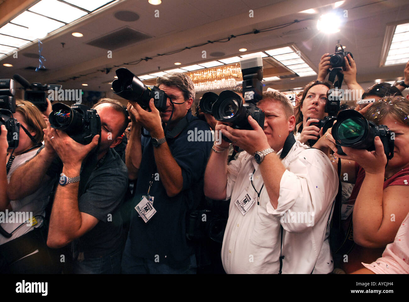 A group of News Photographers shoot during a political election night Stock Photo