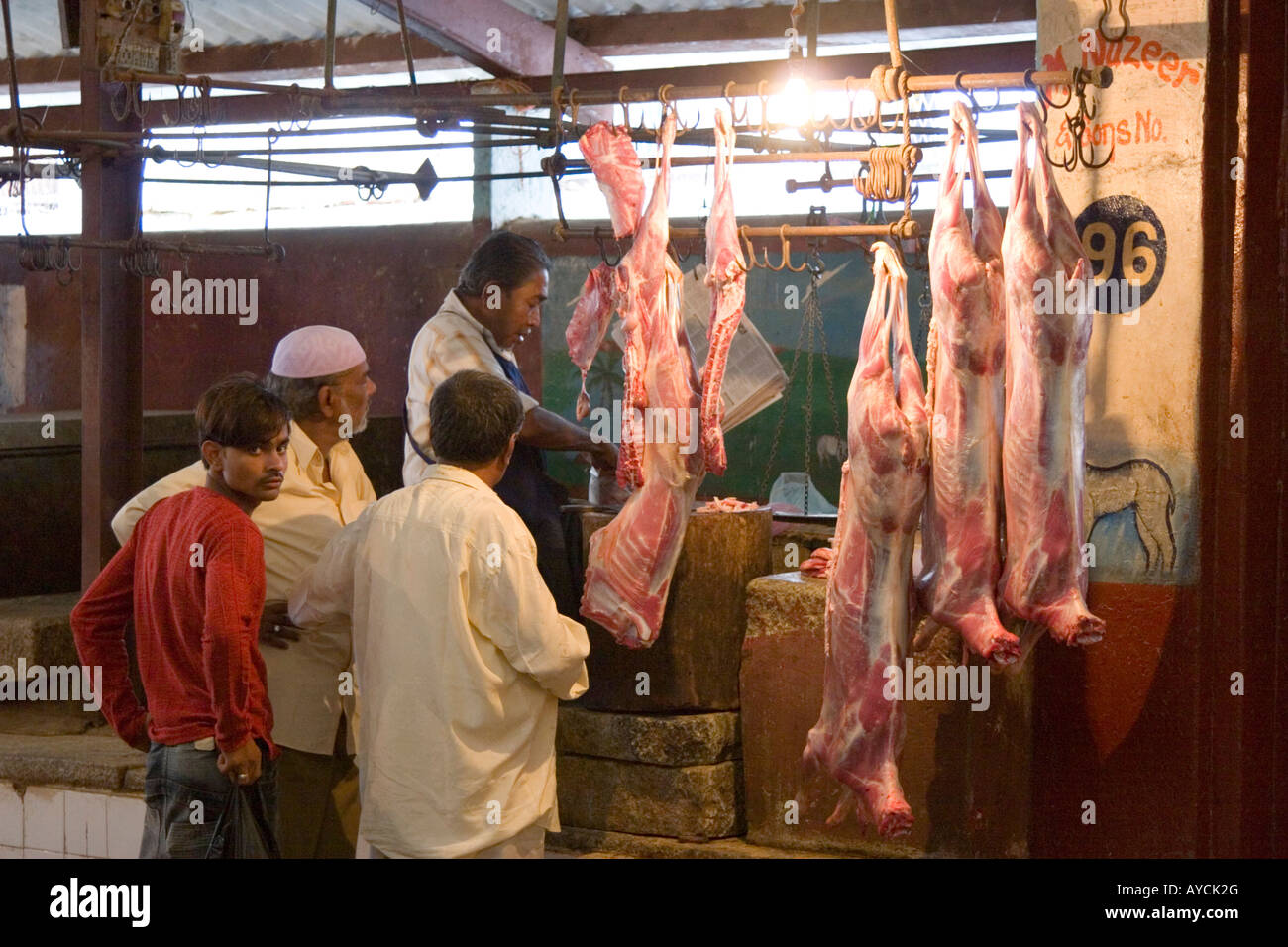 Meat hanging in butcher s shop Russel Market Bangalore Stock Photo Alamy