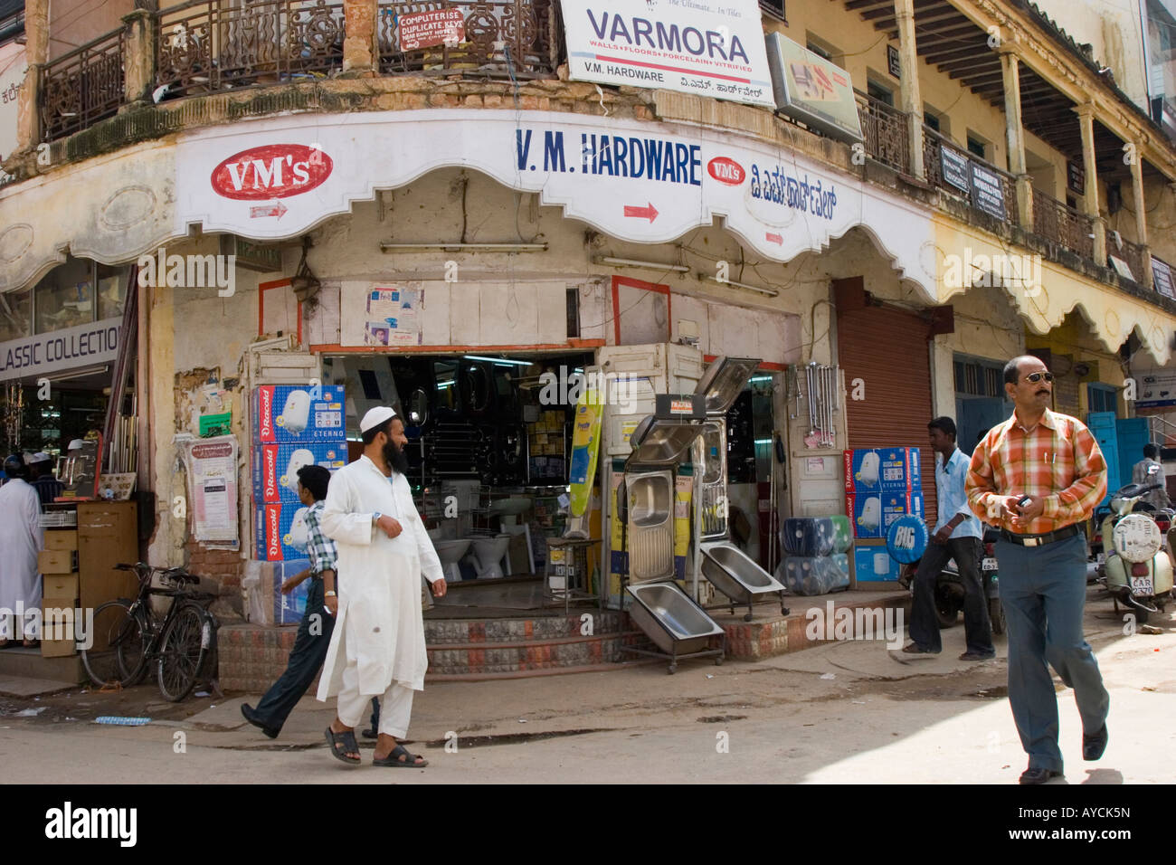 Moslem gentleman outside Indian hardware shop in Bangalore Stock Photo