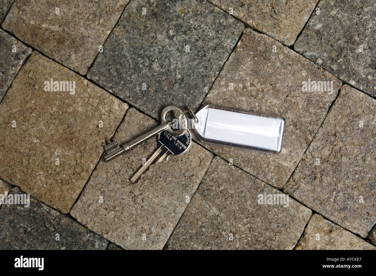A set of house keys on a brick ground Stock Photo Alamy
