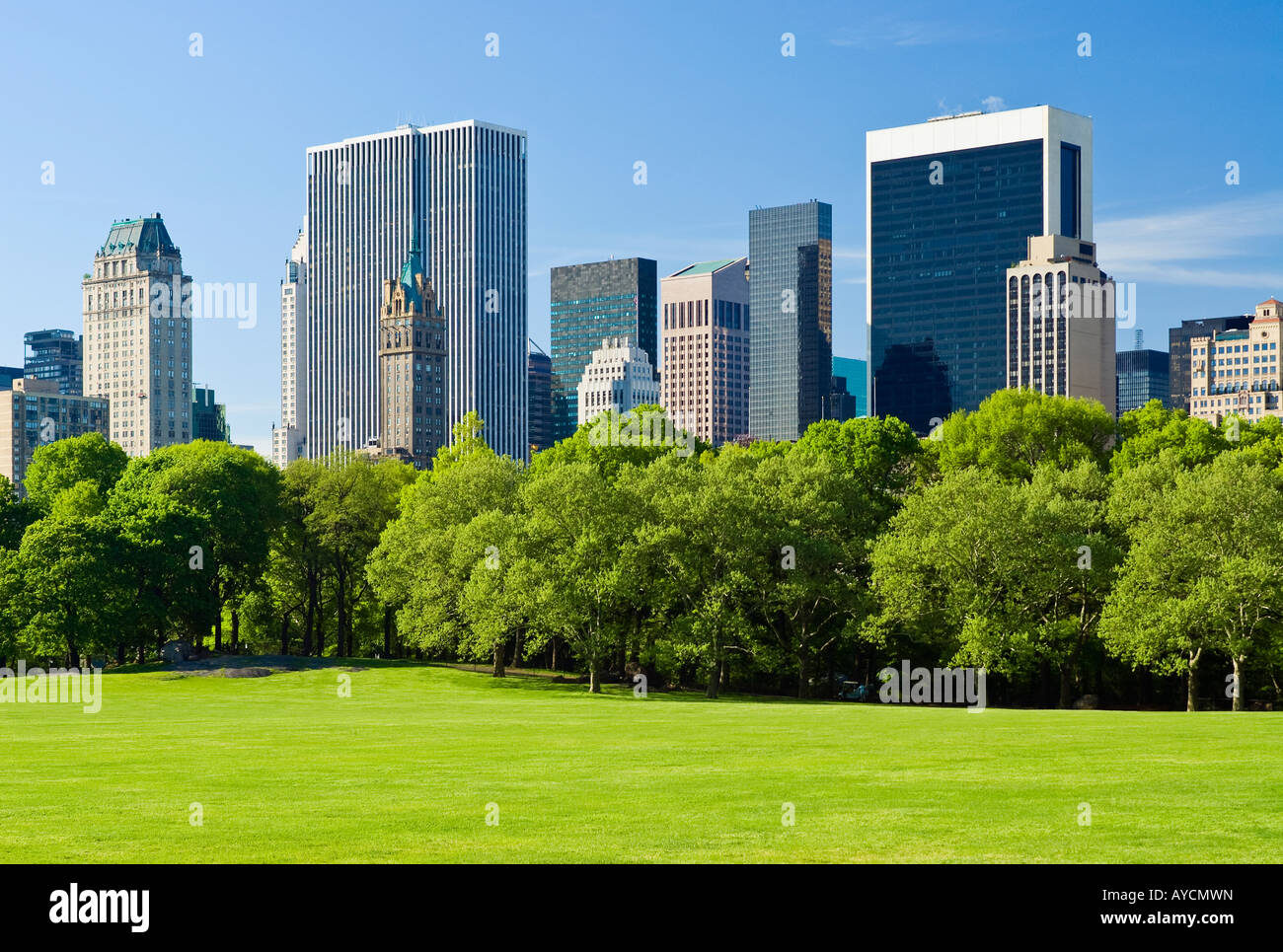 New York City, Central Park in springtime with view of Midtown Manhattan skyline. Stock Photo