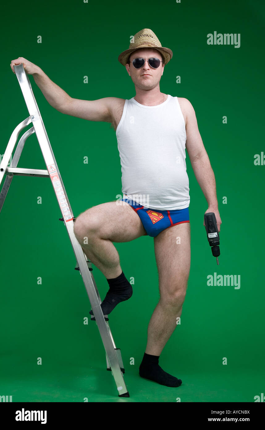 https://c8.alamy.com/comp/AYCNBX/man-doing-diy-in-superman-pants-AYCNBX.jpg