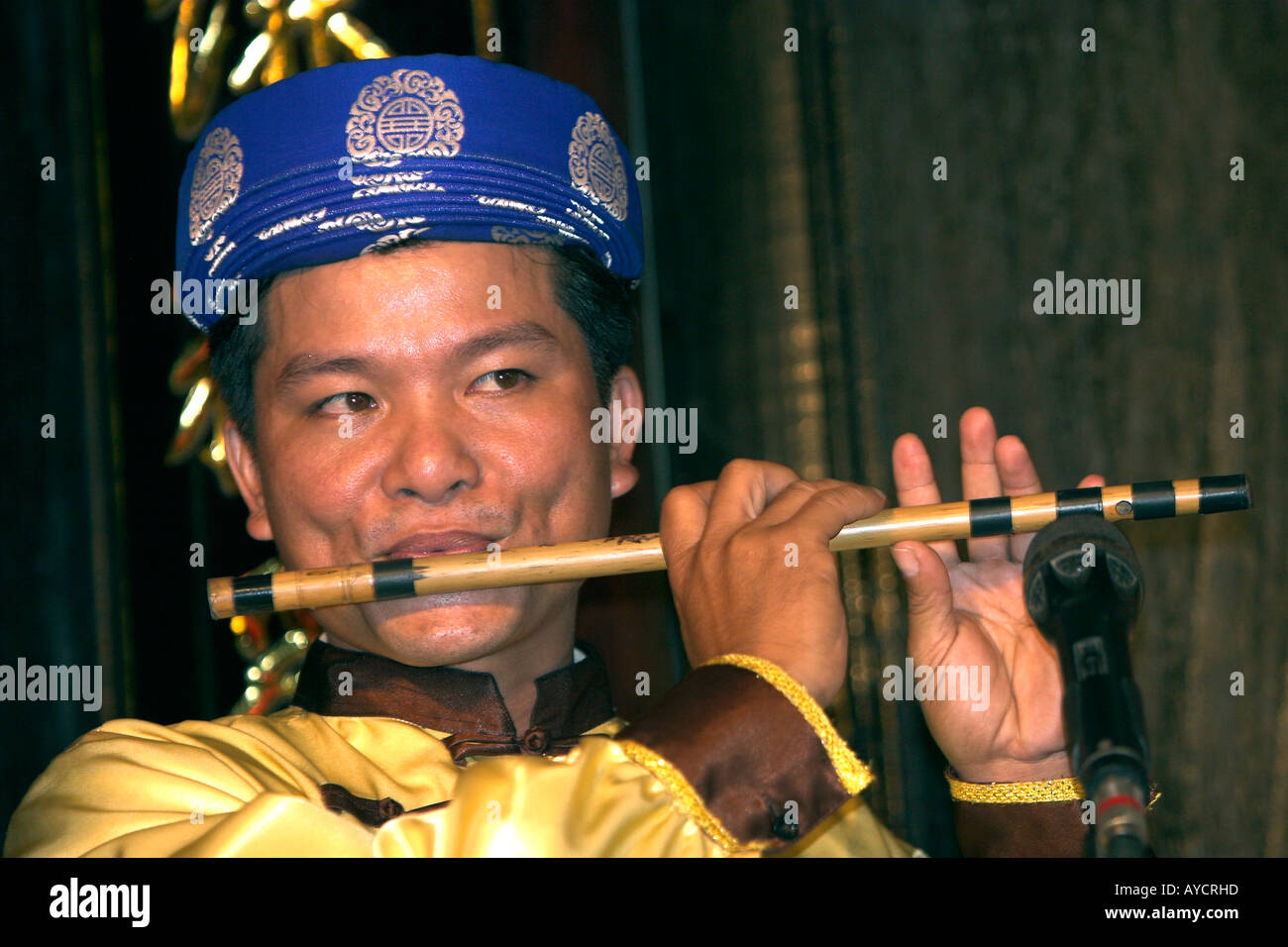 Vietnamese traditional orchestra flute player Hoi An historic town mid