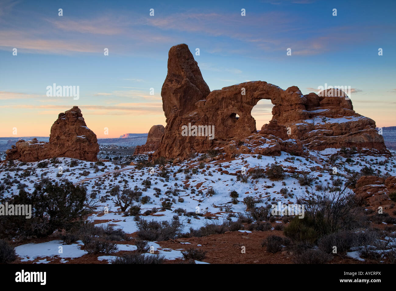 Sunrise glow on Turret Arch with winter snow at Turret Arch at Arches