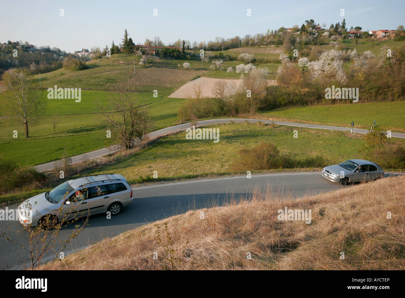 Cars travelling in the Italian countryside in Piedmont near Turin. Stock Photo