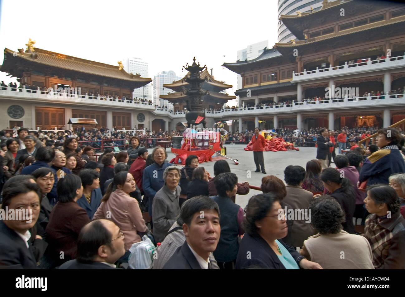 Crowd waiting for a Buddhist religious procession at Jingan Temple, in Shanghai, China. Stock Photo