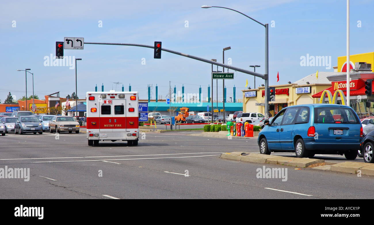 Ambulance driving through traffic hires stock photography and images