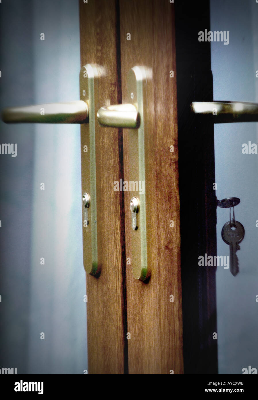 french doors with key Stock Photo - Alamy