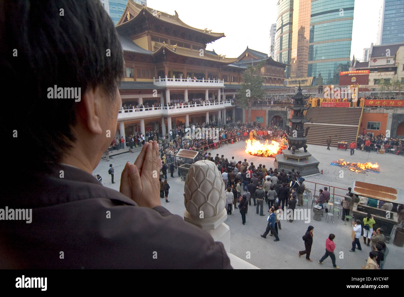 A man praying during a religious procession at Jingan Temple, in ...