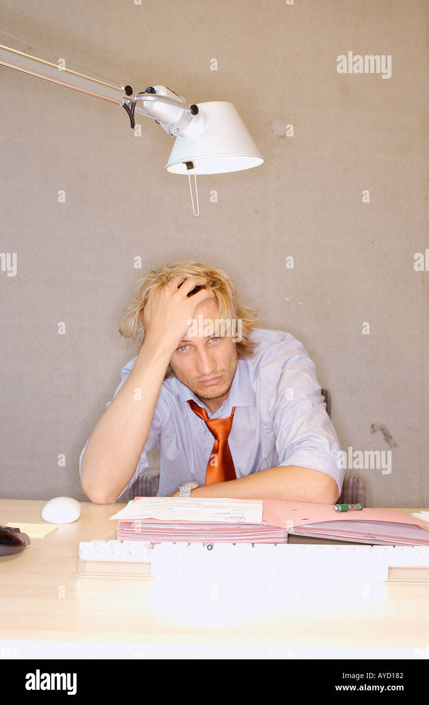 Stressed office worker Stock Photo