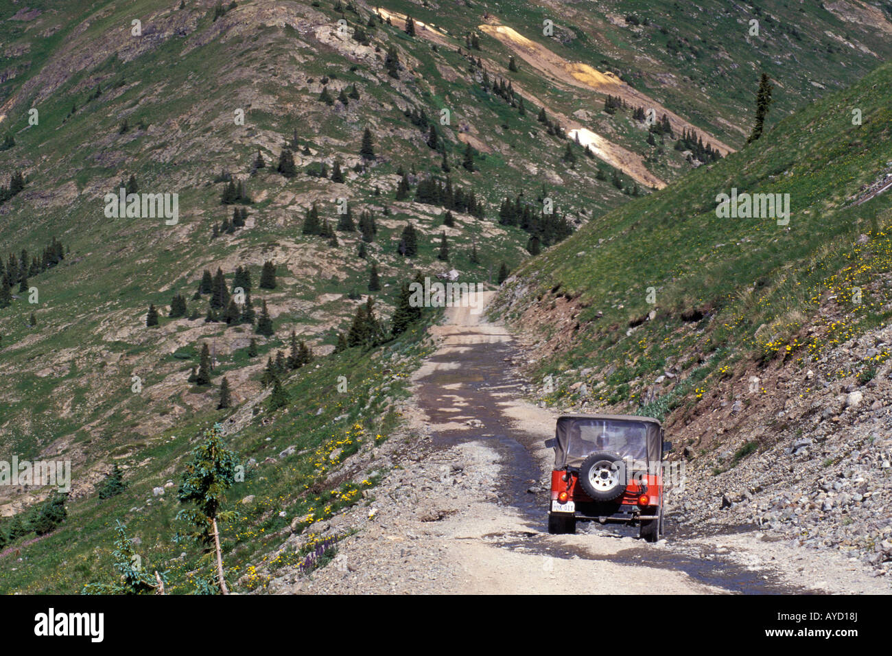 Jeep descends the Alpine Loop Scenic Byway below Cinnamon Pass, San Juan Mountains, Colorado