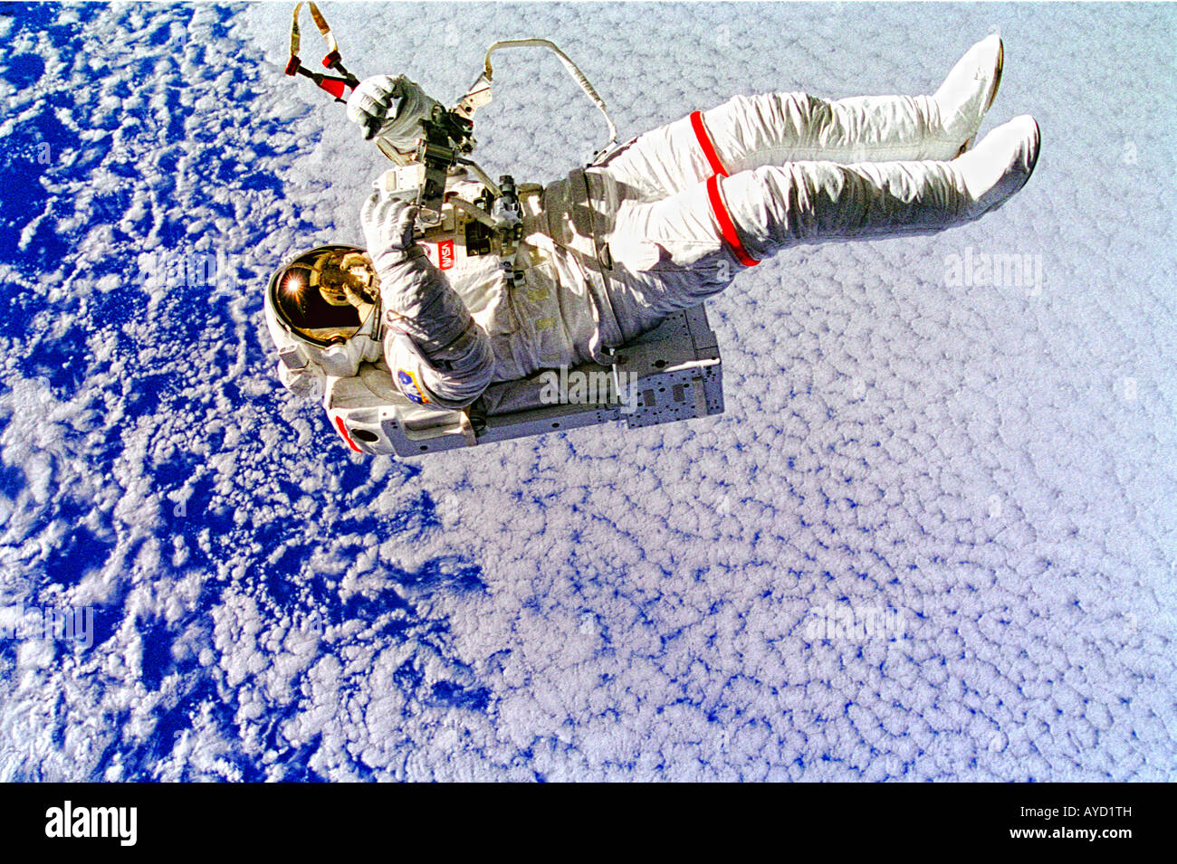 NASA astronaut floating tethered from space shuttle Stock Photo - Alamy