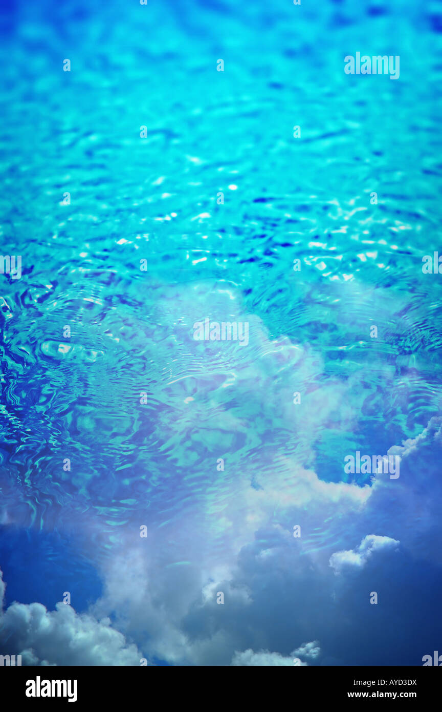 Ripples on deep clear blue water with clouds reflecting on top Stock ...