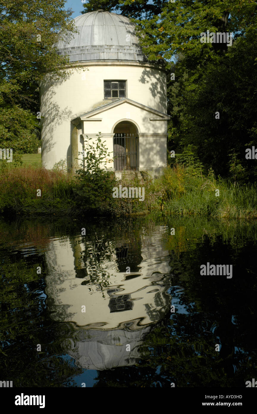 The Ionic Temple reflected in an ornamental lake in the grounds of Chiswick House London England Stock Photo