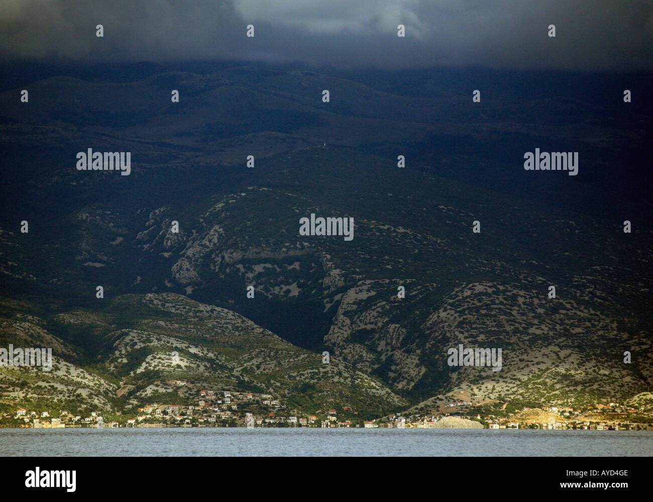 Town under Velebit mountain range viewed from Baska, Krk island, Croatia Stock Photo