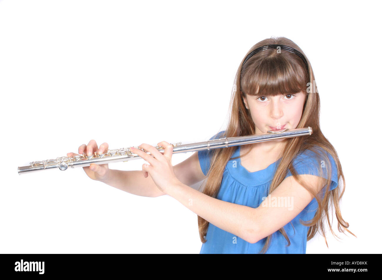 A young girl playing the flute Stock Photo Alamy