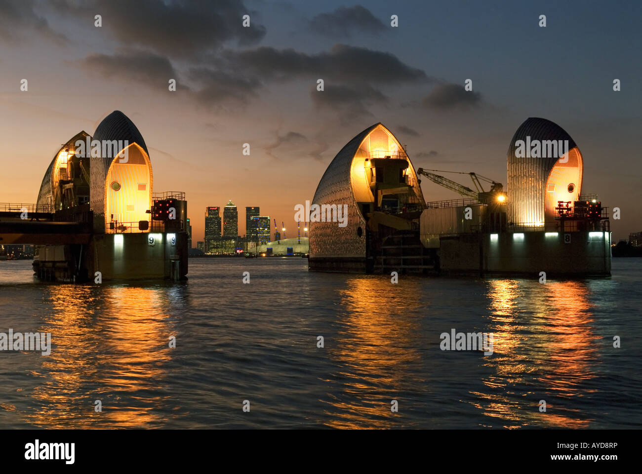 The Thames Barrier with Canary Wharf in the Distance Stock Photo - Alamy