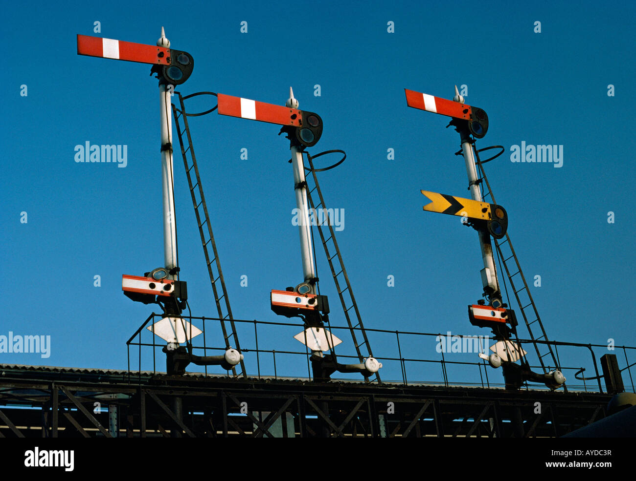 Semaphore signals on gantry over railway, UK, 1970s. Stock Photo