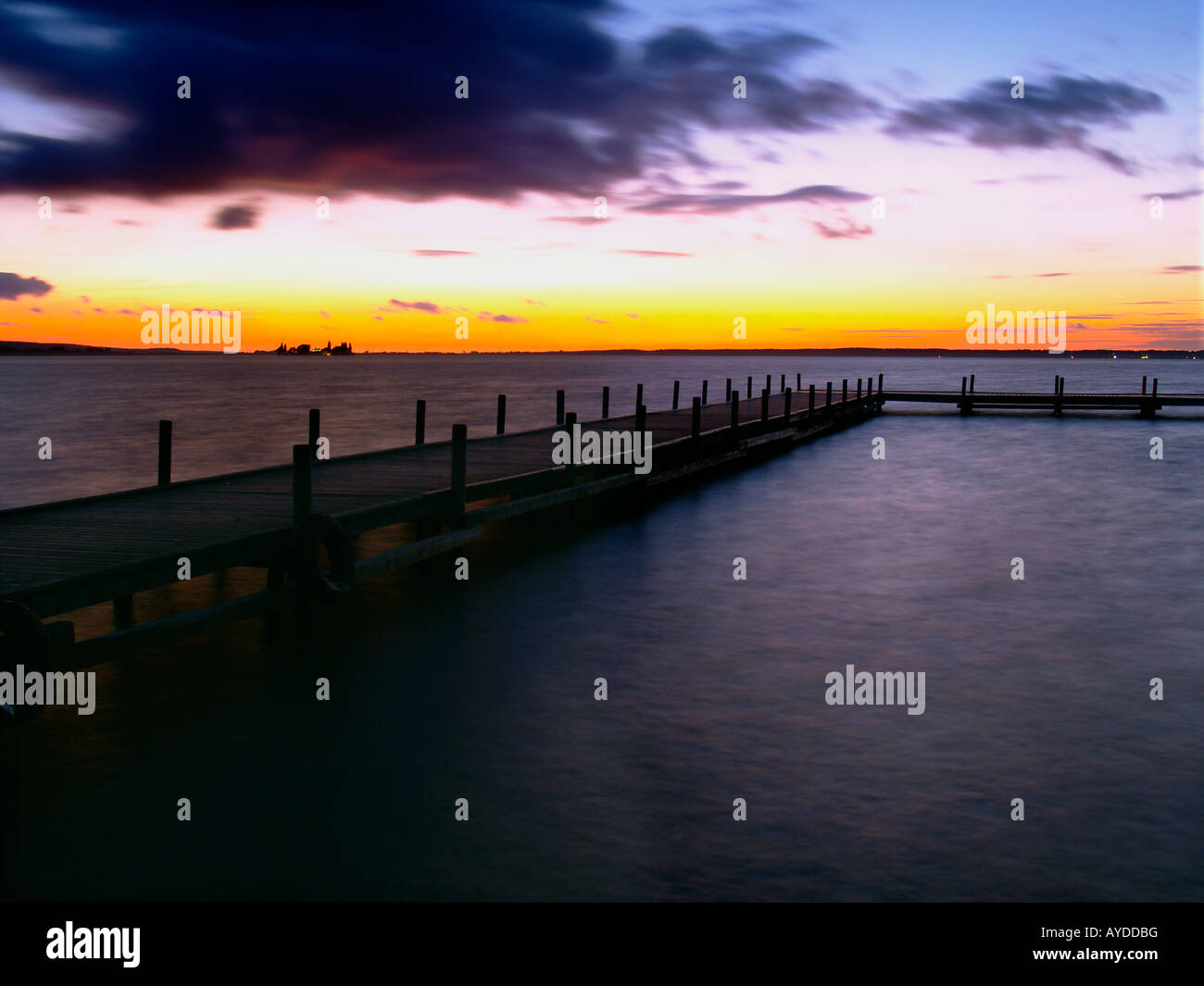 footbridge at the Steinhuder Meer dramatic sky sunset Stock Photo