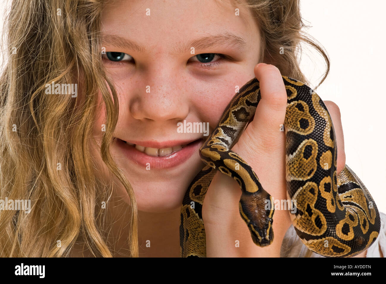 Young girl with her pet python snake Stock Photo