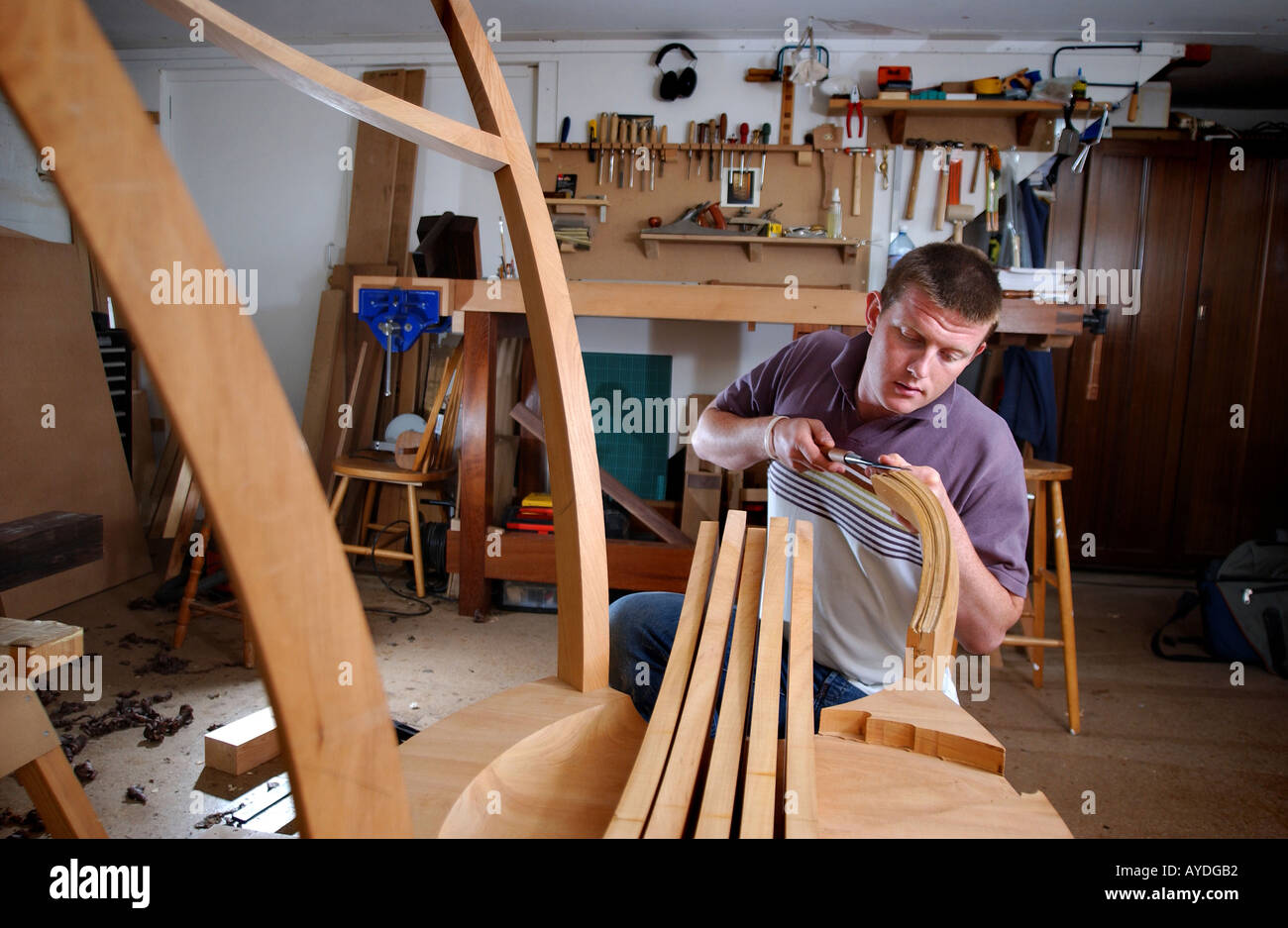 a cabinet maker using tools and working in his studio Stock Photo