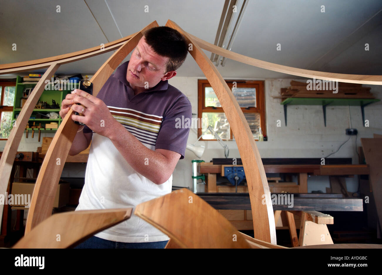 A Cabinet Maker Using Tools And Working In His Studio Stock Photo
