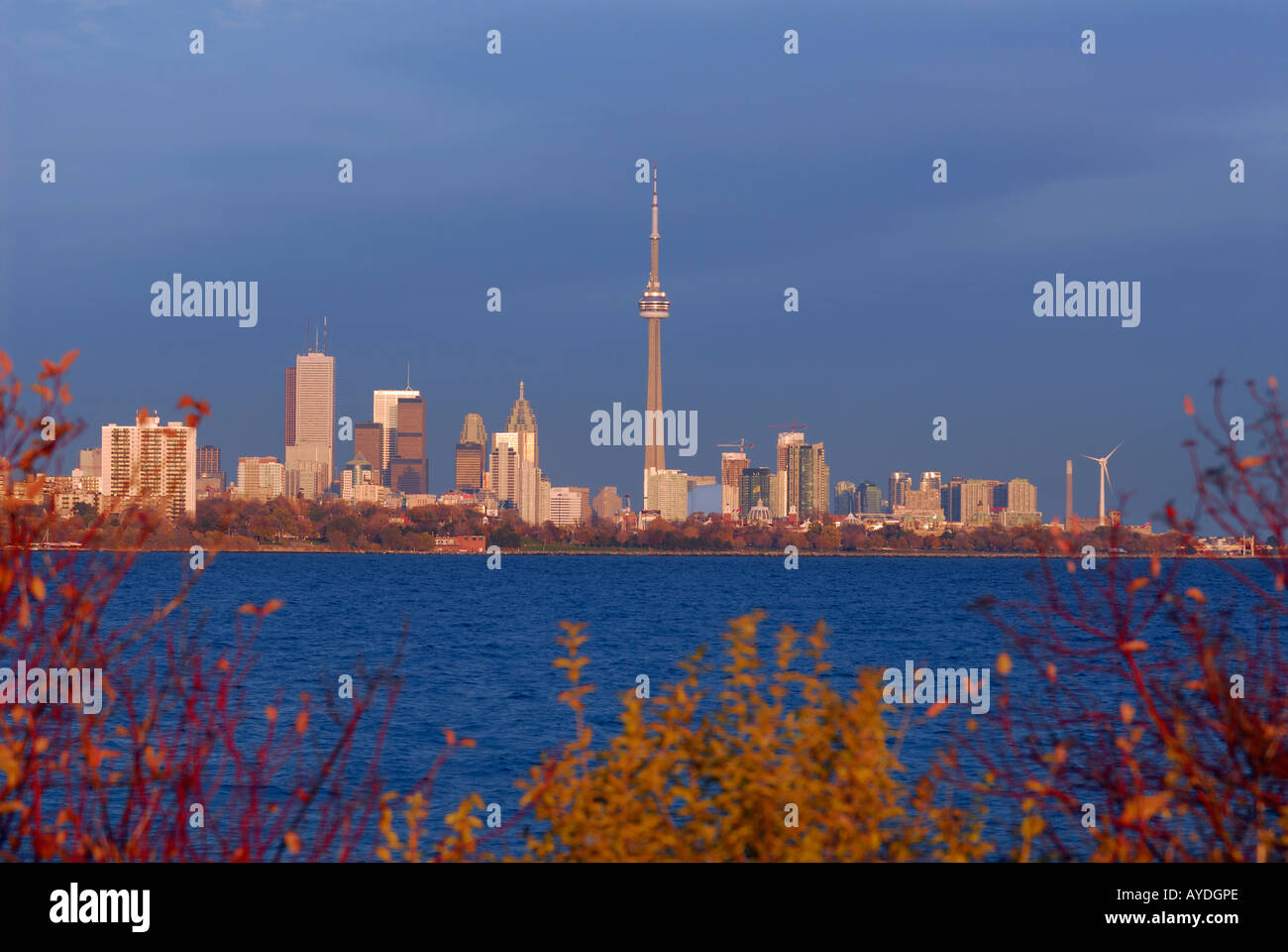 Toronto city skyline at sunset with dark storm clouds from Humber Bay Lake Ontario Stock Photo