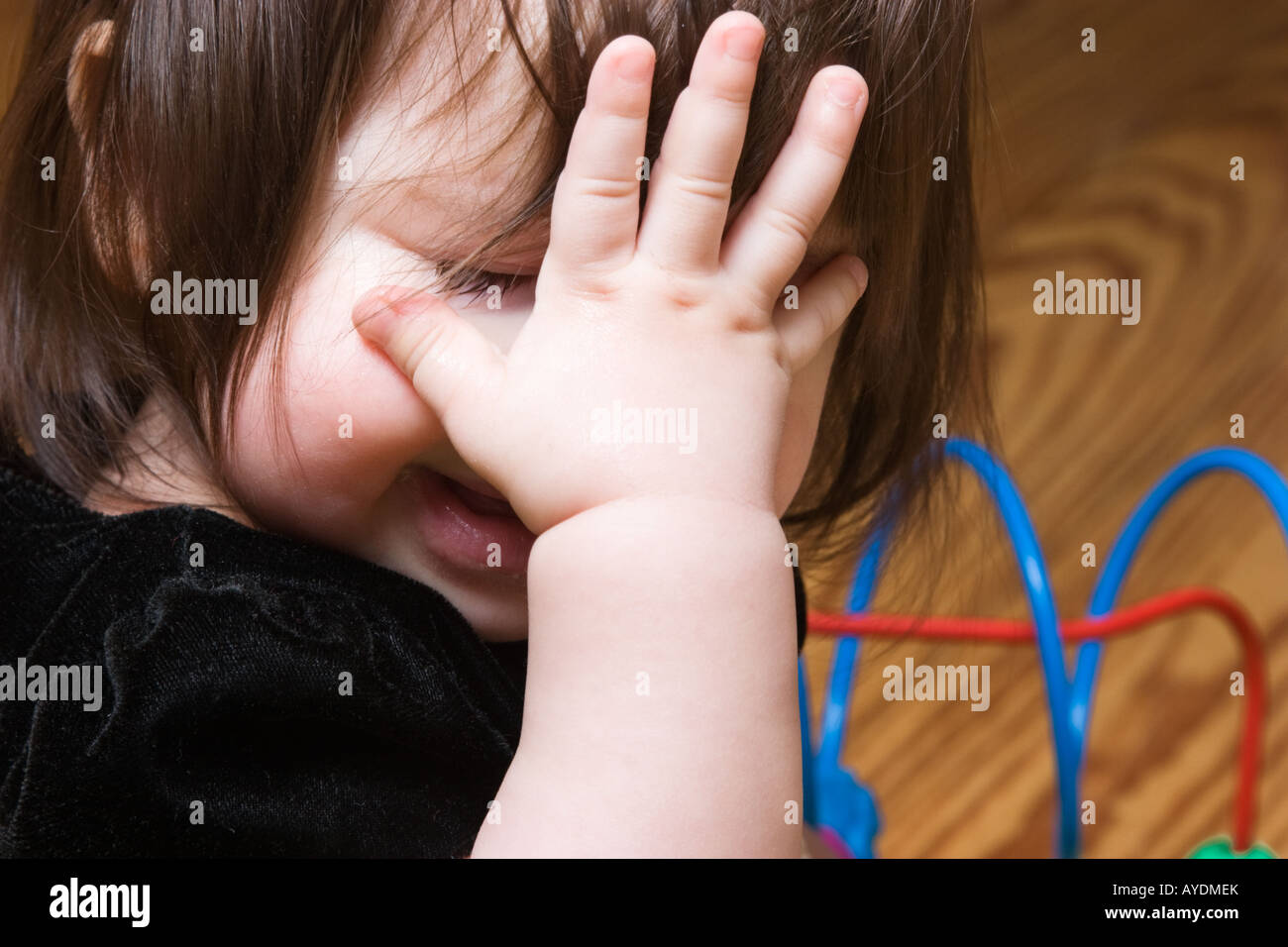 Nine month old baby girl crying Stock Photo