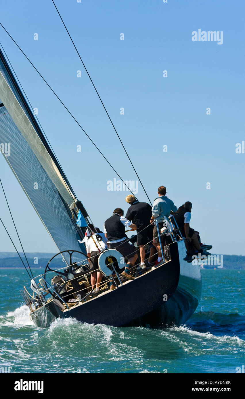 A fully crewed racing yacht catching the wind Stock Photo