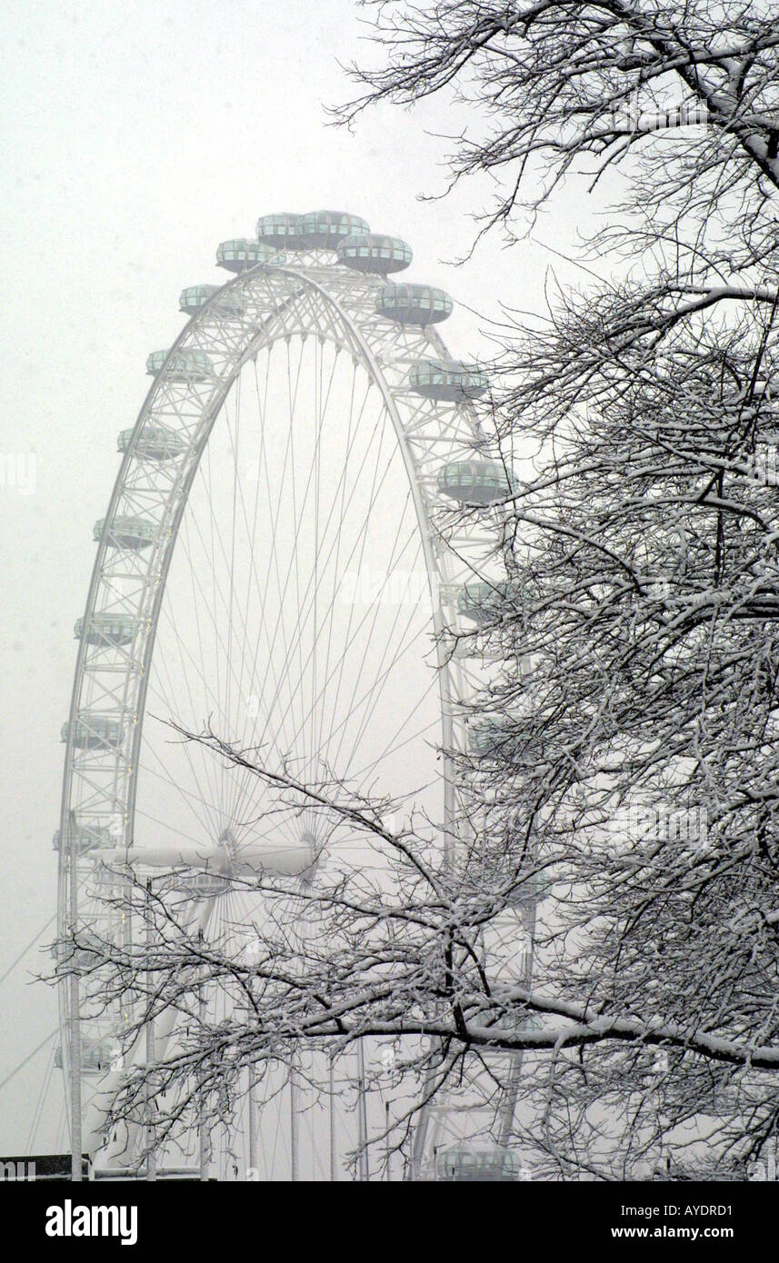 The London Eye on the South Bank in a winter snow storm Stock Photo