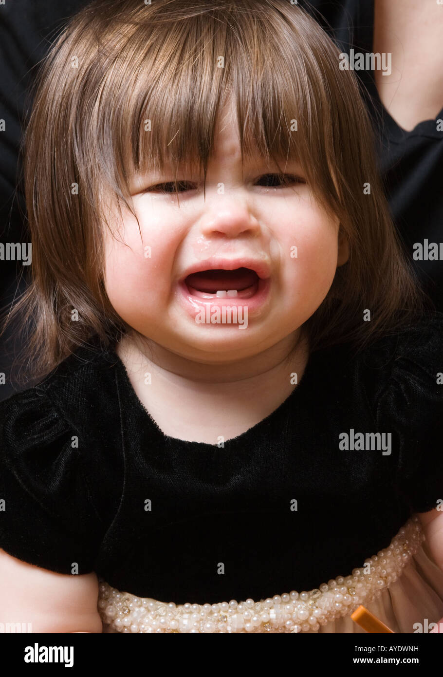 Nine month old baby girl crying Stock Photo Alamy